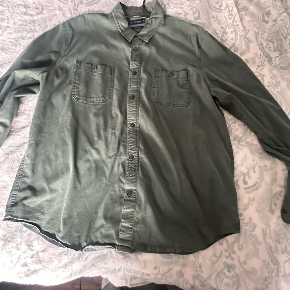A pair of Lucky brand button up shirts.